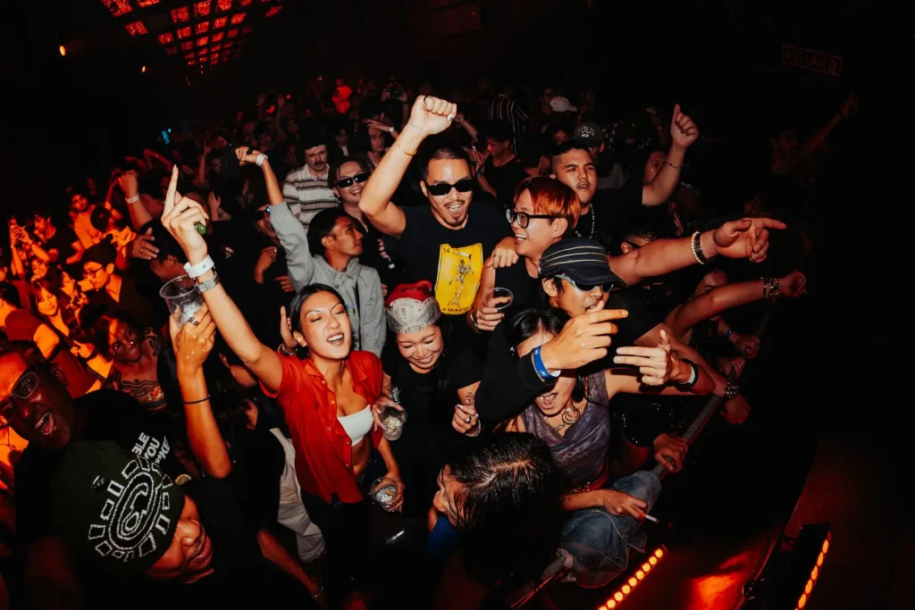 Crowd with hands up at Jambu Jambu Asia's RIRIA show, 2025